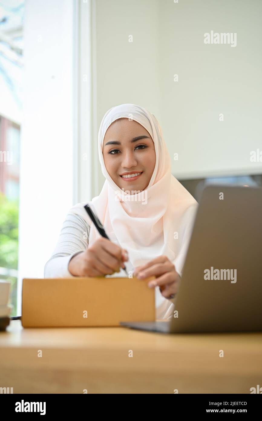 Charming asian muslim female small business entrepreneur