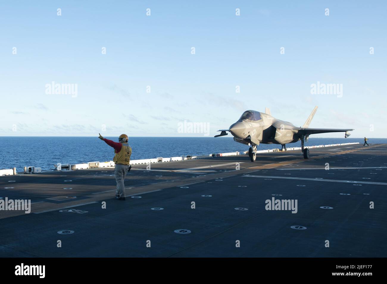 A U.S. Marine Corps F-35B Lightning II aircraft with Marine Fighter Attack Squadron (VMFA) 121 taxis the flight deck aboard the amphibious assault ship USS Tripoli (LHA 7) while underway, June 24, 2022. VMFA-121 is operating in the U.S. 7th Fleet area of operations to enhance interoperability with allies and partners, and serve as a ready response force to defend peace and maintain stability in the Indo-Pacific region.  (U.S. Marine Corps photo by Cpl. Gabriel Durand) Stock Photo