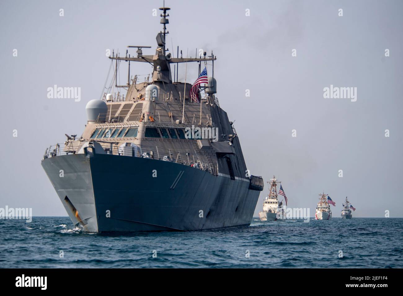 220626-N-NS602-1402 ARABIAN GULF (June 26, 2022) Littoral combat ship USS Sioux City (LCS 11), U.S. Coast guard cutters USCGC Baranof (WPB 1318) and USCGC Robert Goldman (WPC 1142) and coastal patrol ship USS Thunderbolt (PC 12) sail in the Arabian Gulf, June 26. U.S. naval forces regularly operate across the Middle East region to help ensure security and stability. (U.S. Navy photo by Chief Mass Communication Specialist Roland A. Franklin) Stock Photo