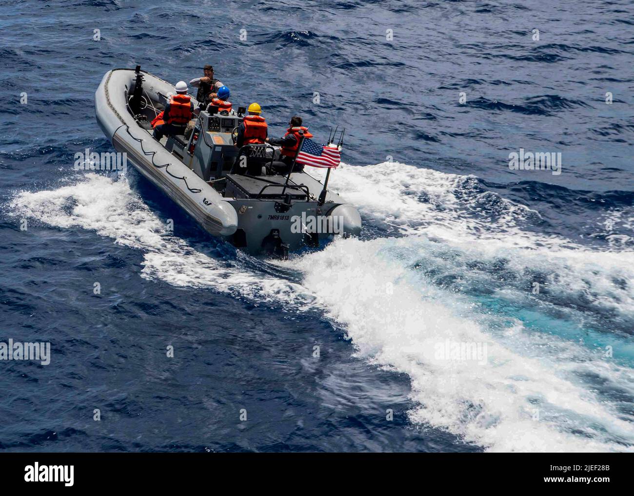 PACIFIC OCEAN (June 23, 2022) Sailors assigned to the Arleigh Burke-class guided-missile destroyer USS Gridley (DDG 101), transit on a rigid-hull inflatable boat (RHIB) during a personnel transfer. Abraham Lincoln Carrier Strike Group is underway conducting routine operations in the U.S. 3rd Fleet. (U.S. Navy photo by Mass Communication Specialist 2nd Class Colby A. Mothershead) Stock Photo