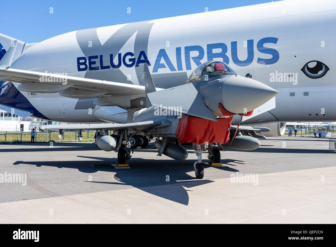 Twin-engine, canard delta wing, multirole fighter Eurofighter Typhoon against the backdrop of an Airbus A300-600ST Beluga. Stock Photo