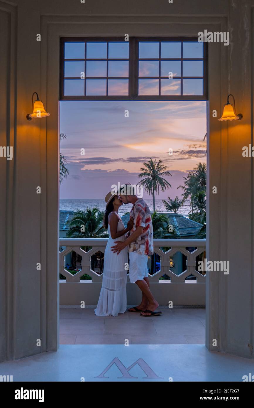 Woman watching sunset balcony hi-res stock photography and images - Alamy