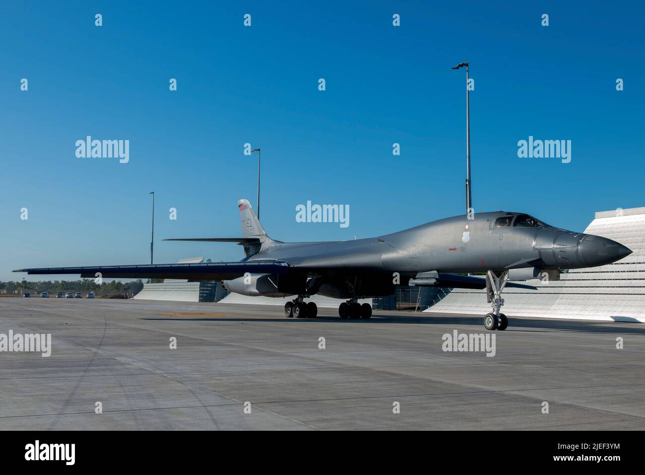 A U.S. Air Force B-1B Lancer attached to the 34th Bomb Squadron, Ellsworth, South Dakota, taxies down the flightline of the Darwin Airport after landing at the Royal Australian Air Force Base, Darwin, NT, Australia, June 22, 2022. Bomber Task Force missions strengthen the collective ability of the U.S. and our allies and partners to maintain a free and open Indo-Pacific. (U.S. Air Force photo by Senior Airman Quentin Marx) Stock Photo