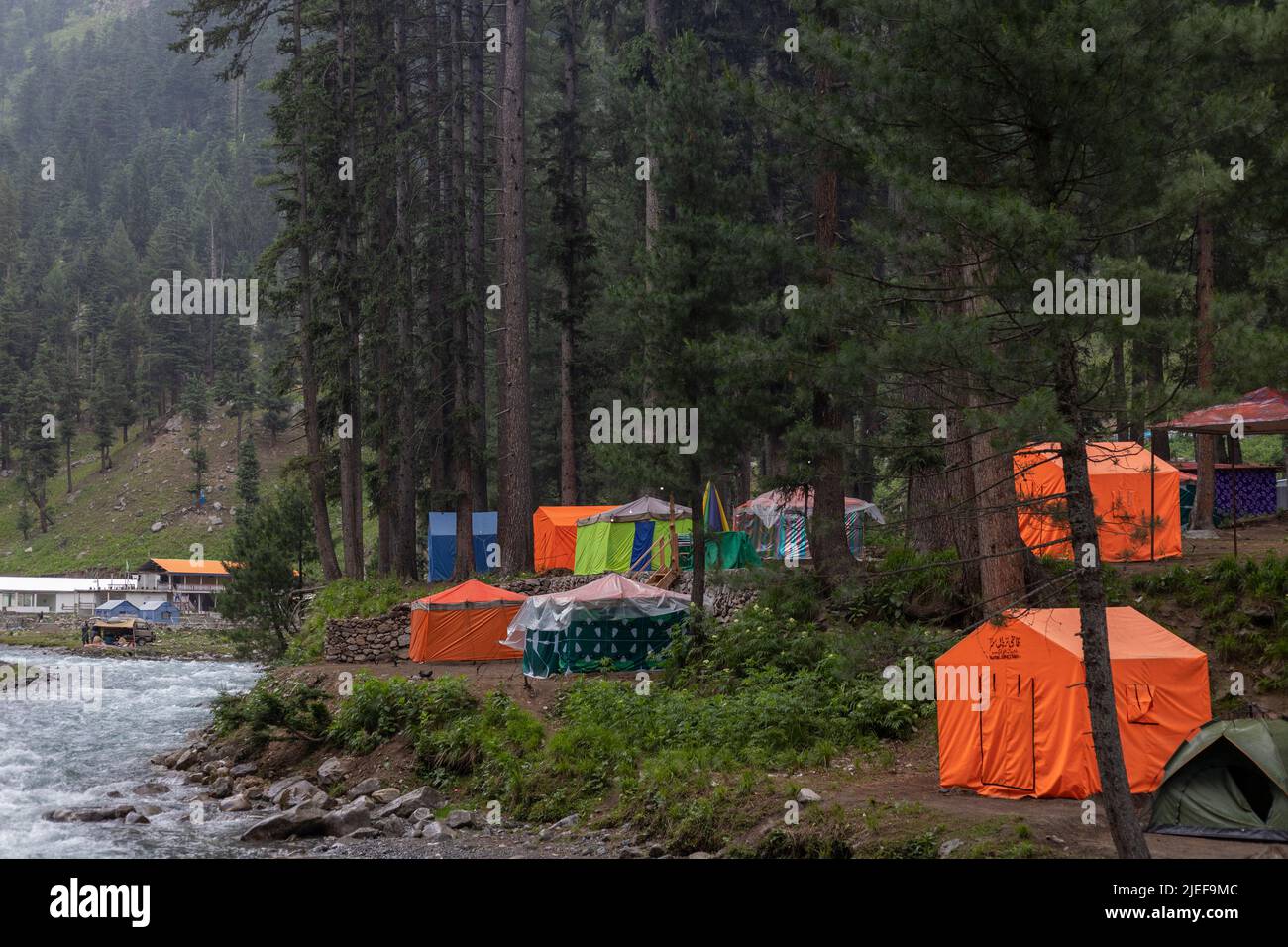 Holiday destination in Pakistan, tent village on a riverbank in kumrat valley Stock Photo