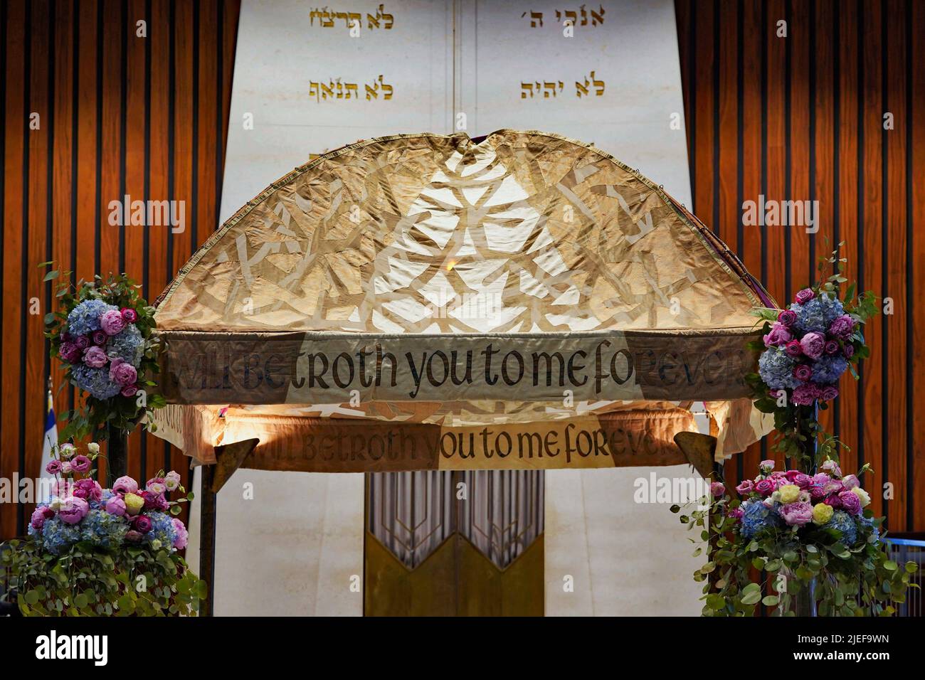 Traditional Jewish wedding canopy with biblical quotation from the Book of Hoshea, 'I will betroth you to me forever' Stock Photo