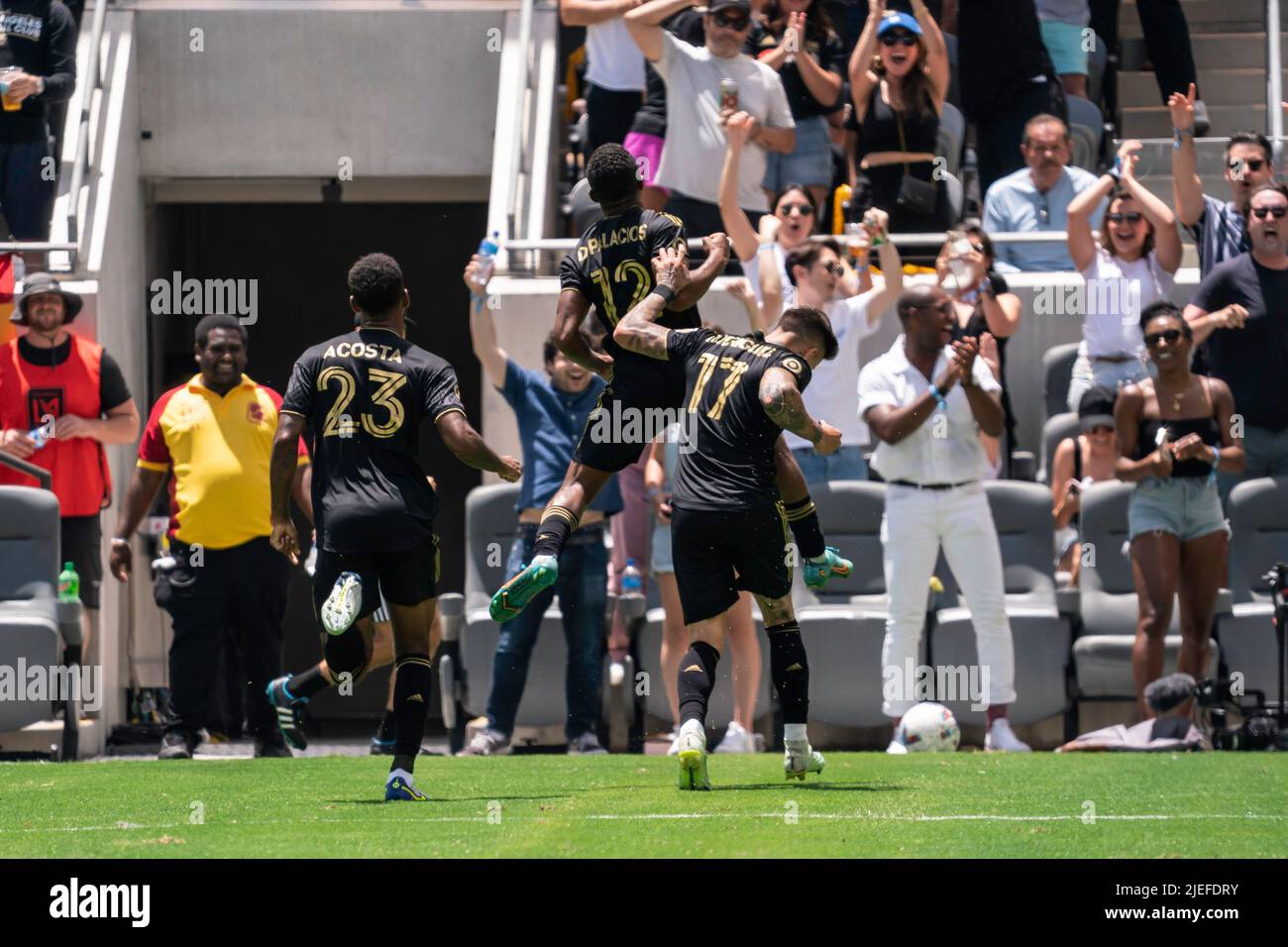 Los Angeles FC defender Diego Palacios (12) celebrates a goal with teammates midfielder Brian Rodríguez (17) and midfielder Kellyn Acosta (23) during Stock Photo
