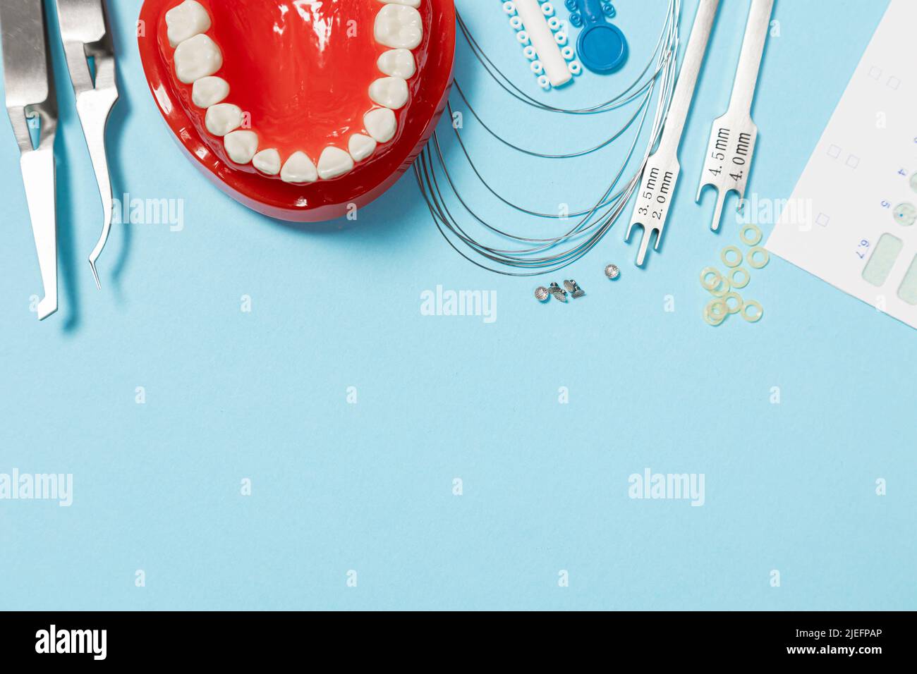 a set of special tools for an orthodontist to install braces for a