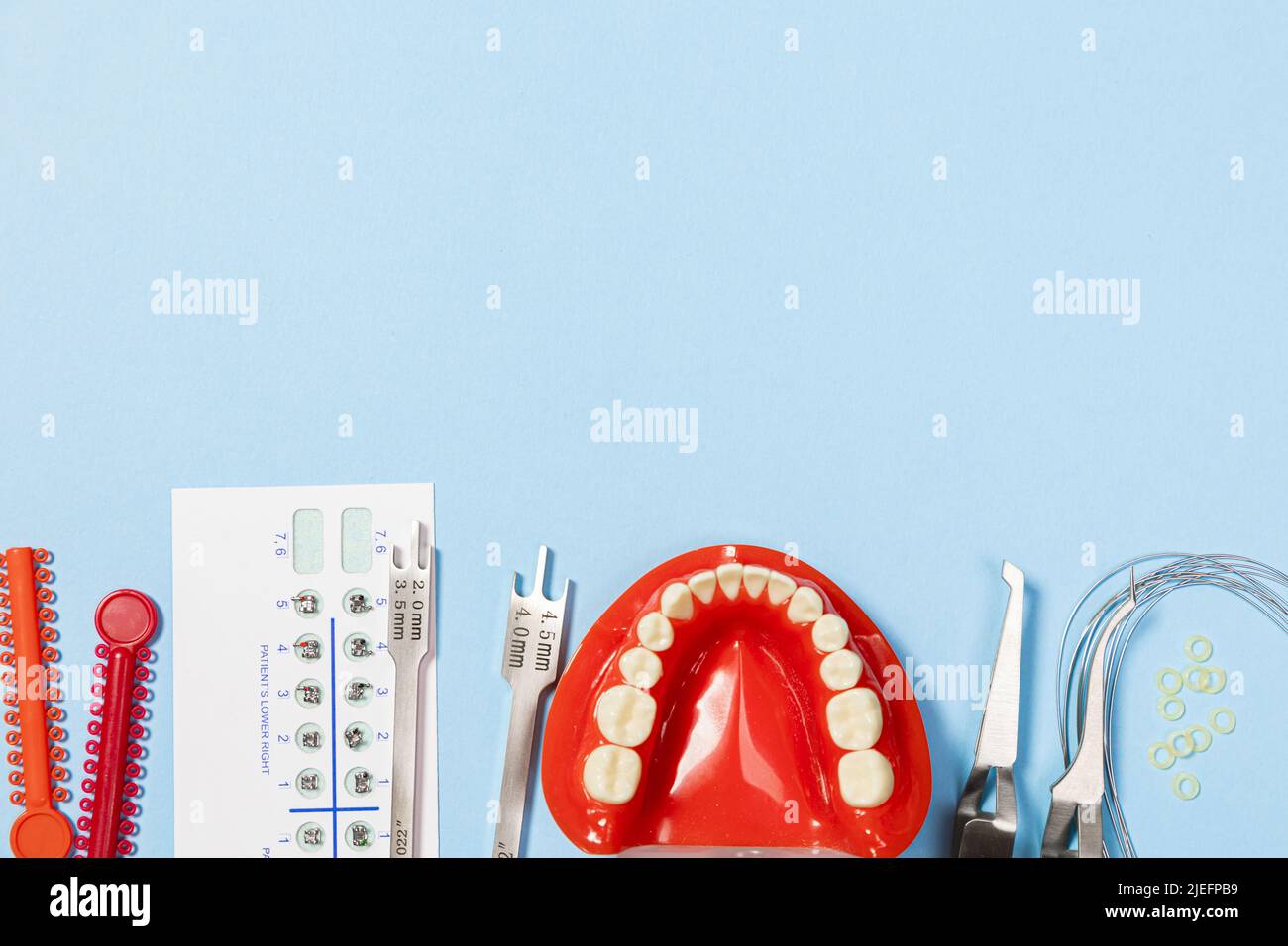 a set of special tools for an orthodontist to install braces for a patient. Orthodontic arcs