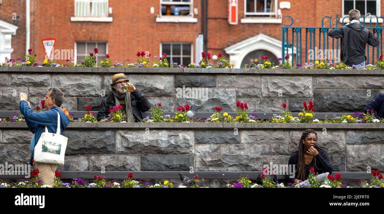 Dublin, Ireland June 3, 2022 People resting on the bench in the