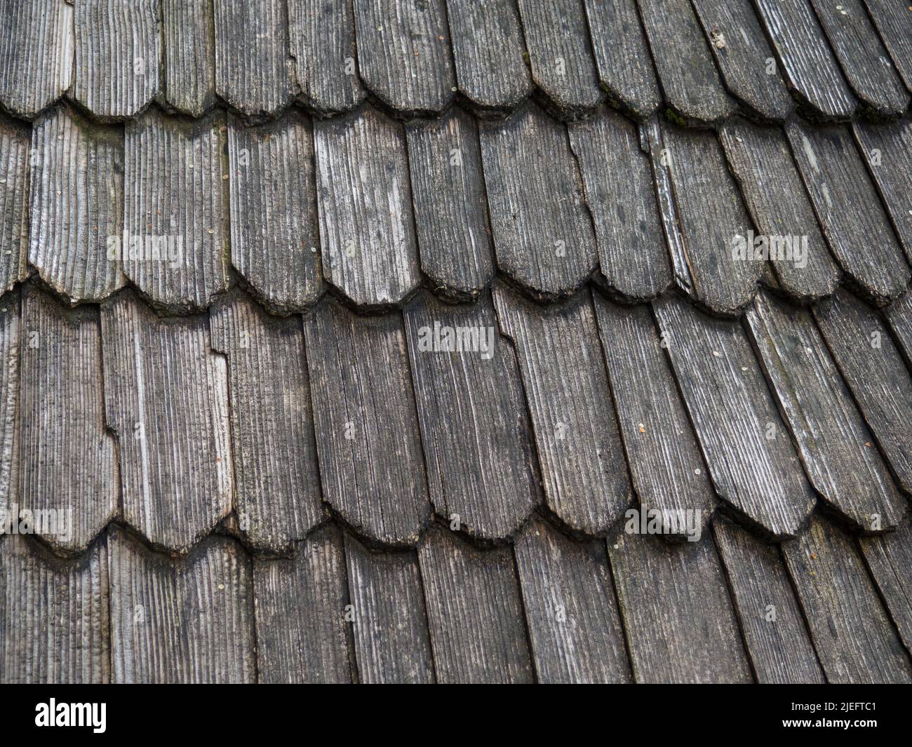 Old wood shingle roof with rough surface Stock Photo