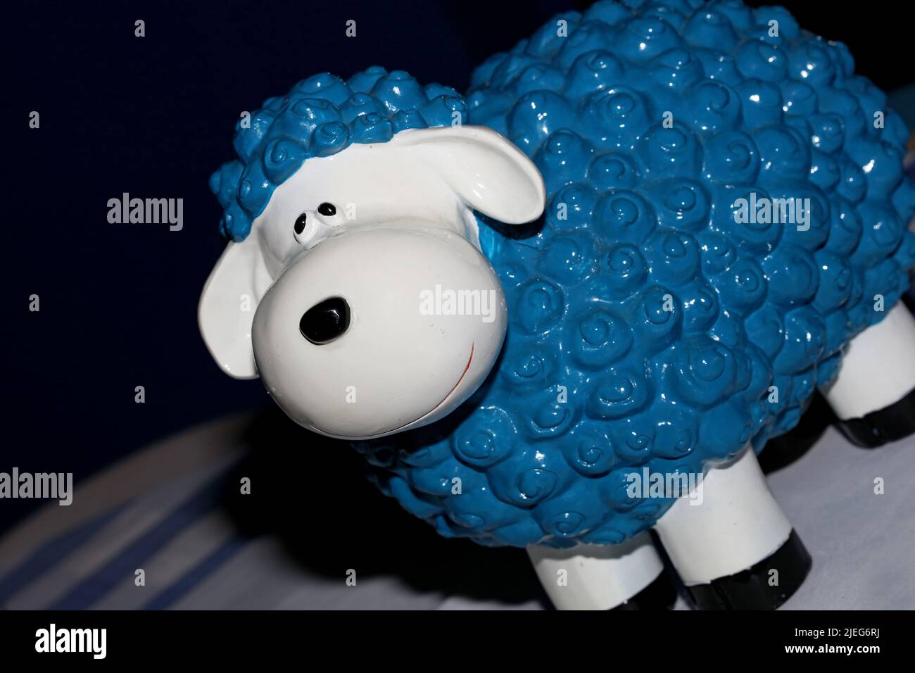 Clay sheep with white face and blue body macro modern background high quality print Stock Photo