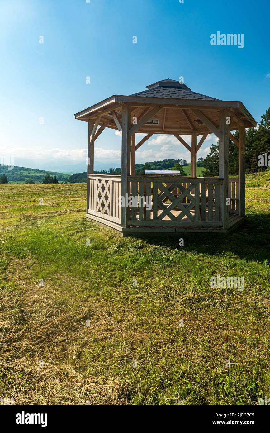 Wooden gazebo on meadow above Lucky village in Slovakia Stock Photo