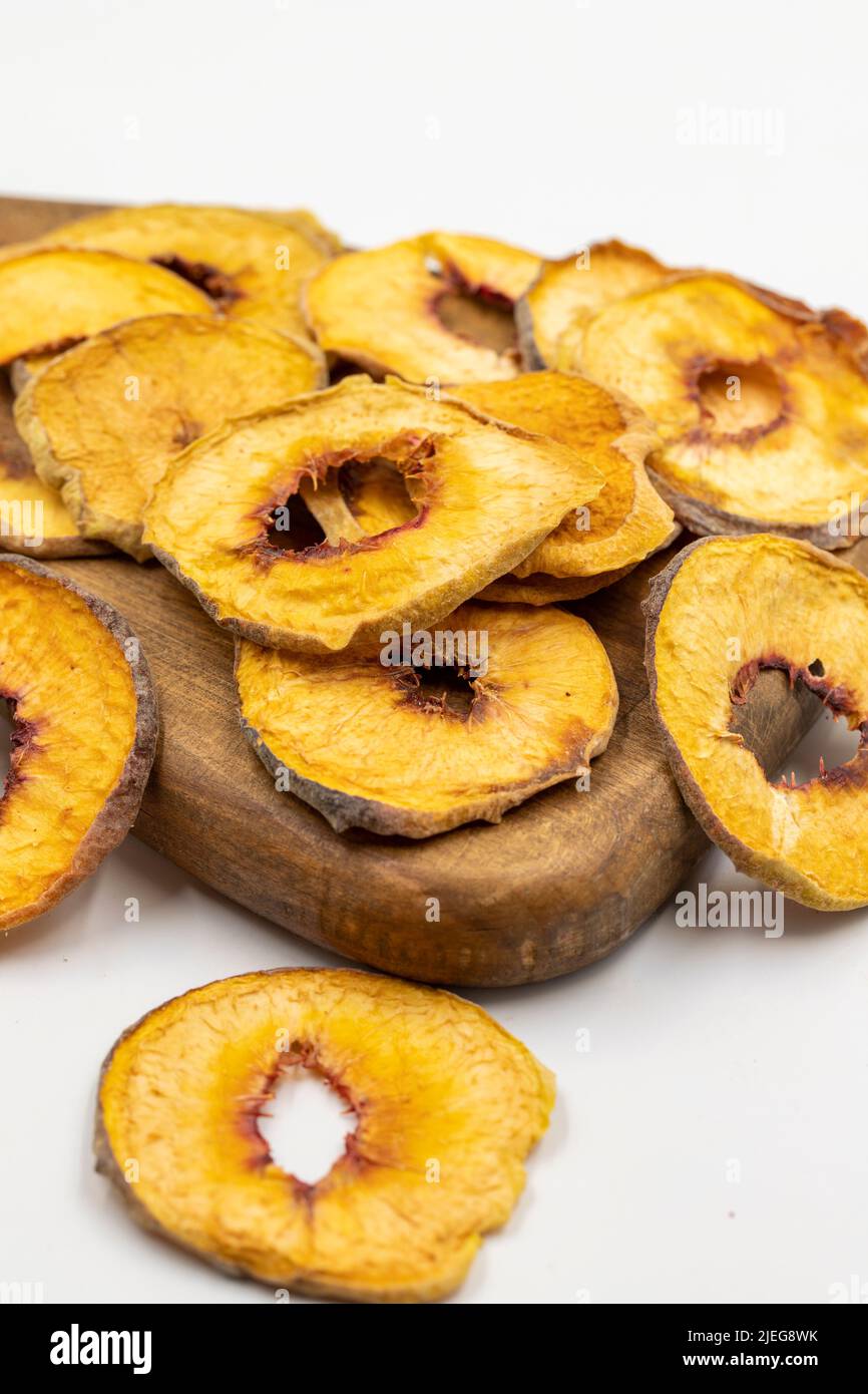 Dried peach slices. Sliced dry peach isolated on white background. Sun