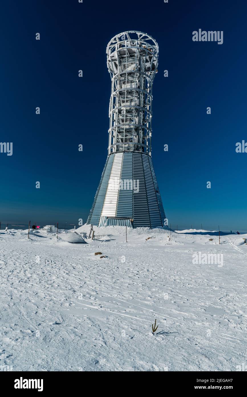 Lookout tower on Kralicky Sneznik hill on czech - polish borders during beautiful winter day with clear sky Stock Photo