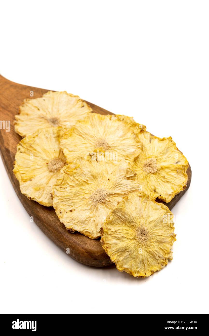 Dried pineapple slices. Sliced dry pineapple isolated on white background. Sundried fruit