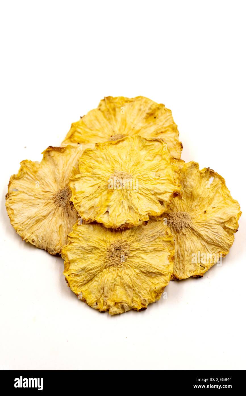Dried pineapple slices. Sliced dry pineapple isolated on white background. Sundried fruit