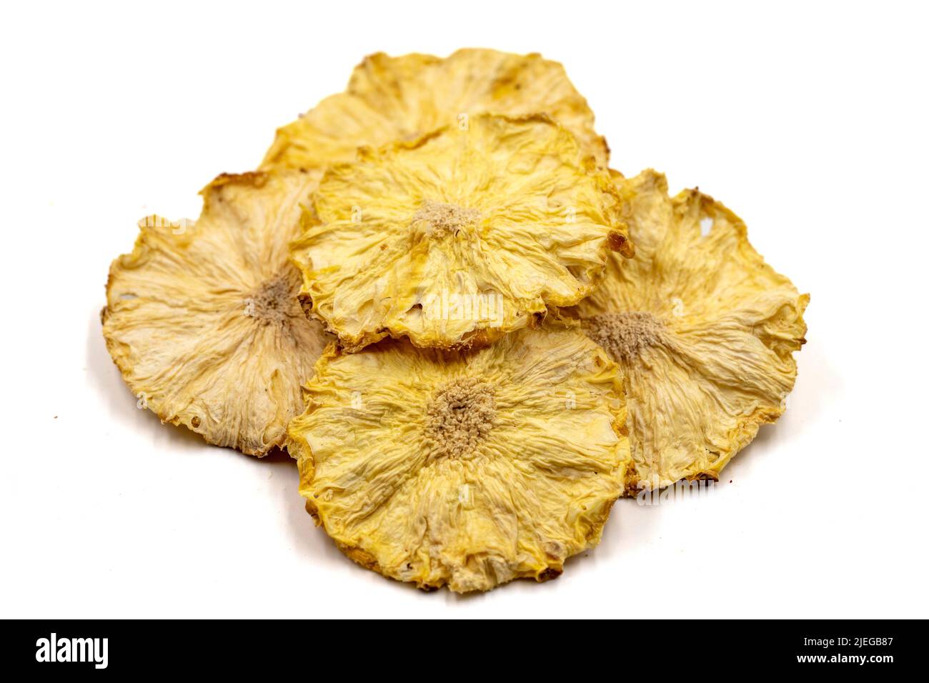 Dried pineapple slices. Sliced dry pineapple isolated on white background. Sundried fruit