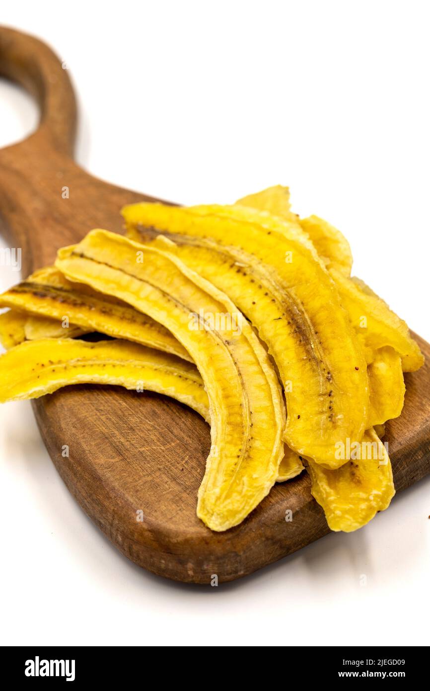 Dried banana slices. Sliced dried banana isolated on white background