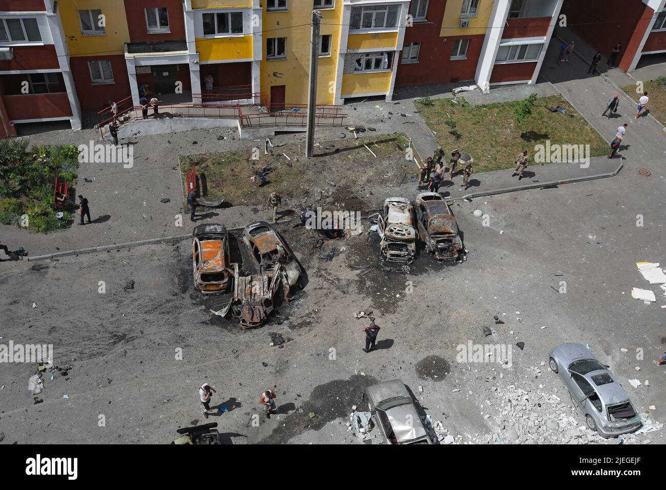 A crater is seen in the ground between burnt-out cars after the Russian troops attacked a northern neighbourhood with a BM-30 Smerch multiple rocket launcher, Kharkiv, northeastern Ukraine, June 26, 2022. Photo by Vyacheslav Madiyevskyy/Ukrinform/ABACAPRESS.COM Stock Photo