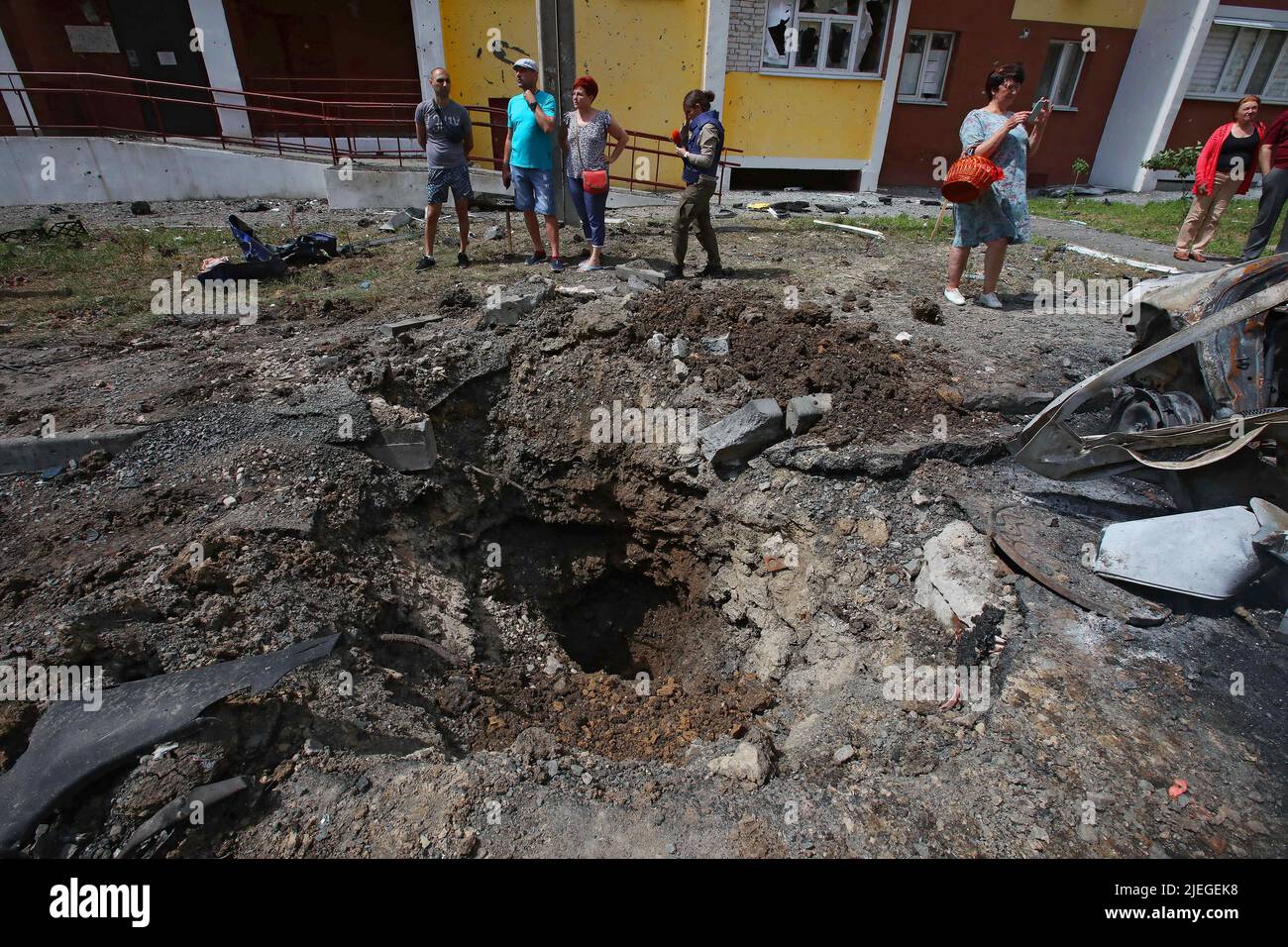 A crater is seen in the ground in the yard of an apartment block after the Russian troops shelled a northern neighbourhood with a BM-30 Smerch multiple rocket launcher, Kharkiv, northeastern Ukraine, June 26, 2022. Photo by Vyacheslav Madiyevskyy/Ukrinform/ABACAPRESS.COM Stock Photo