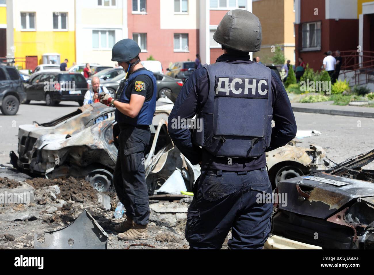 State Emergency Service employees partake in the response effort to the shelling of a northern neighbourhood by Russian troops with a BM-30 Smerch multiple rocket launcher, Kharkiv, northeastern Ukraine, June 26, 2022. Photo by Vyacheslav Madiyevskyy/Ukrinform/ABACAPRESS.COM Stock Photo