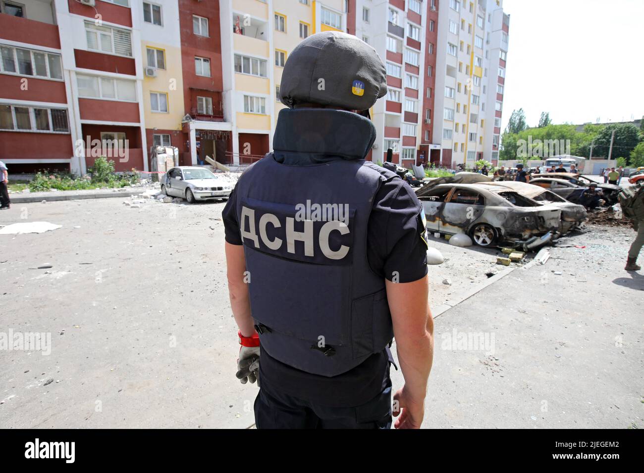 A State Emergency Service employee partakes in the response effort to the shelling of a northern neighbourhood by Russian troops with a BM-30 Smerch multiple rocket launcher, Kharkiv, northeastern Ukraine, June 26, 2022. Photo by Vyacheslav Madiyevskyy/Ukrinform/ABACAPRESS.COM Stock Photo