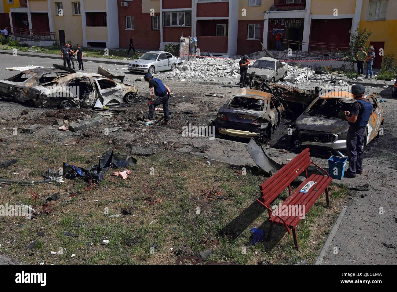 State Emergency Service employees partake in the response effort to the shelling of a northern neighbourhood by Russian troops with a BM-30 Smerch multiple rocket launcher, Kharkiv, northeastern Ukraine, June 26, 2022. Photo by Vyacheslav Madiyevskyy/Ukrinform/ABACAPRESS.COM Stock Photo