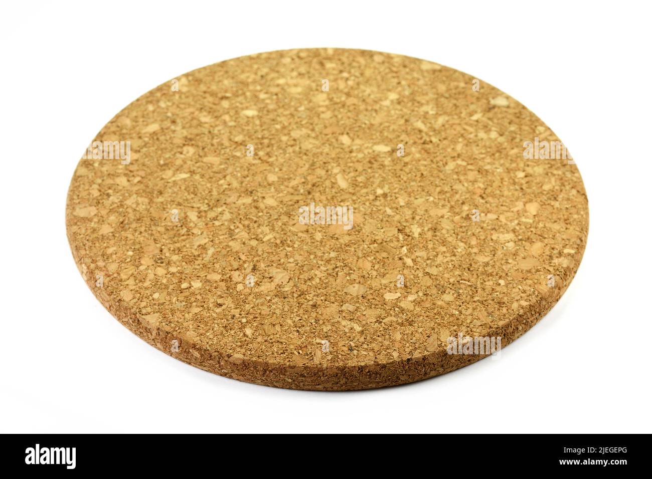 Empty round cork coaster, isolated on white background. Stock Photo