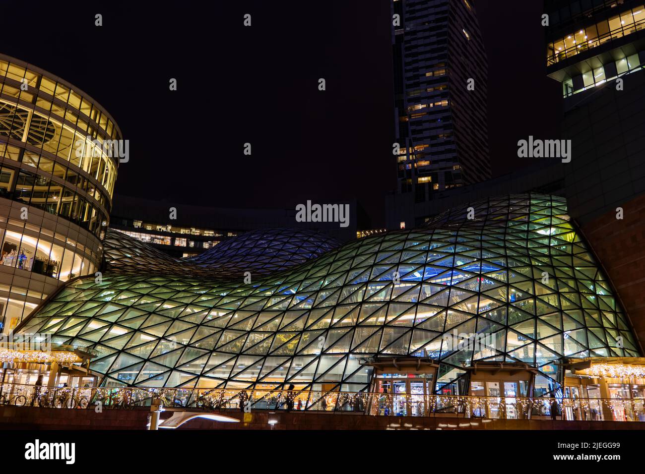 Warsaw, Poland - December 14, 2020: Zlote Tarasy (Golden Terraces) shopping mall and entertainment complex with glass roof at night, modern, contempor Stock Photo