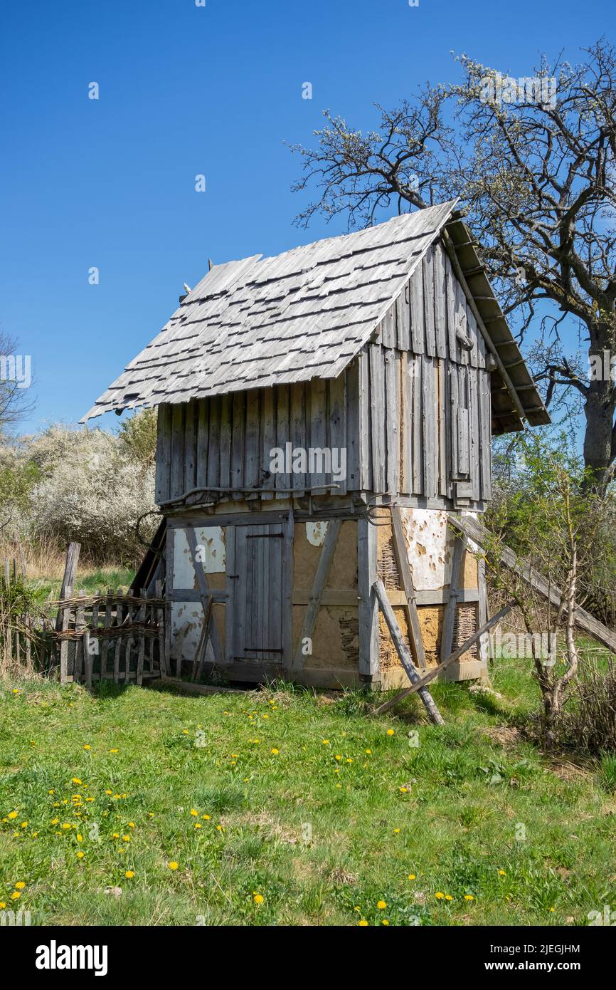 Rustic medieval hut in sunny ambiance at early spring time Stock Photo