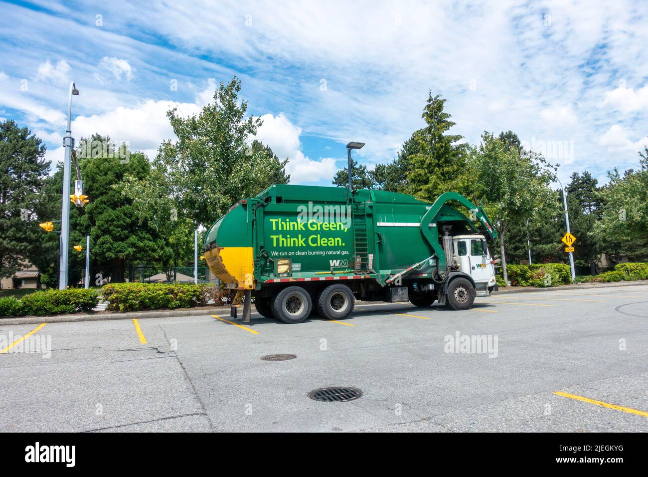Green Garbage Truck in Surrey Stock Photo Alamy