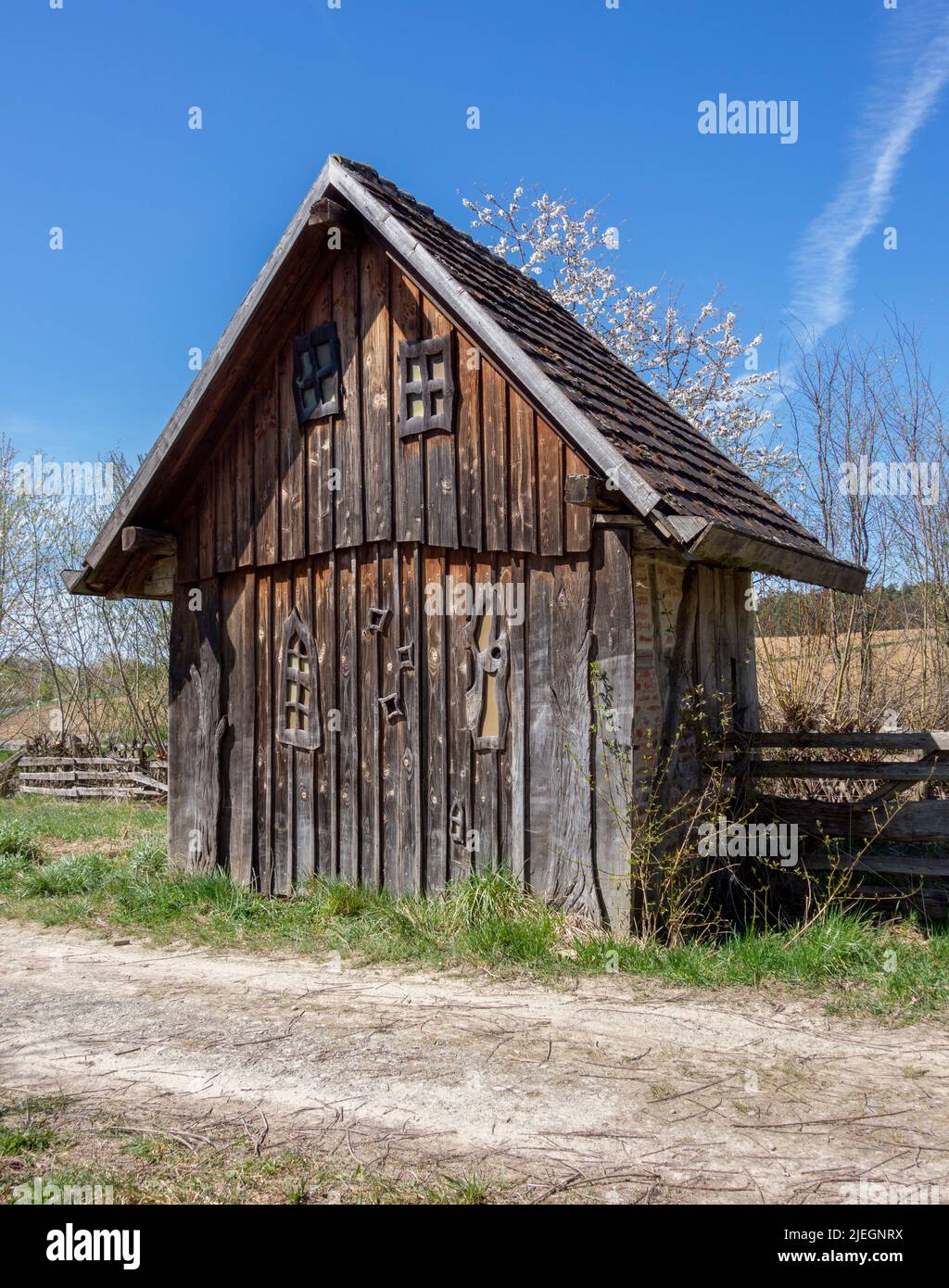 Medieval wooden hut in sunny ambiance at early spring time Stock Photo