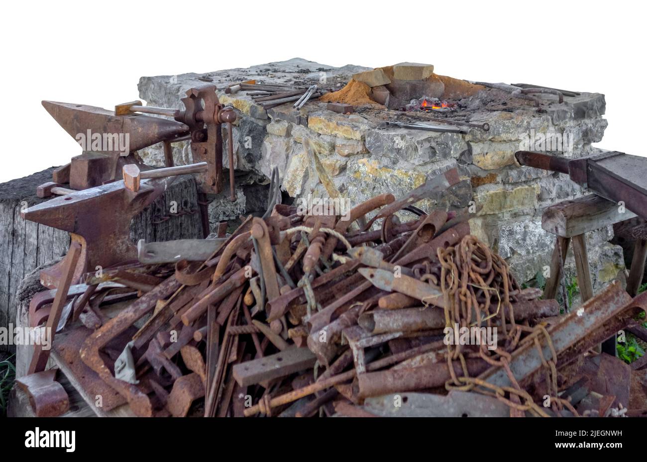 Medieval forge scenery including lots of scrap metal isolated in white back Stock Photo