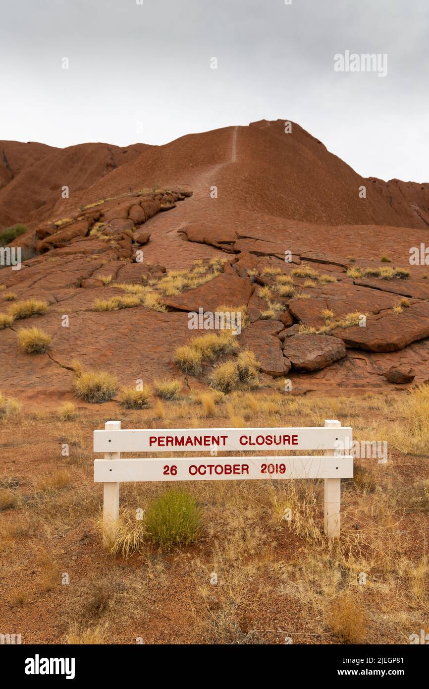 Sign at th former hiking track at Uluru, showing its permanently closed Stock Photo