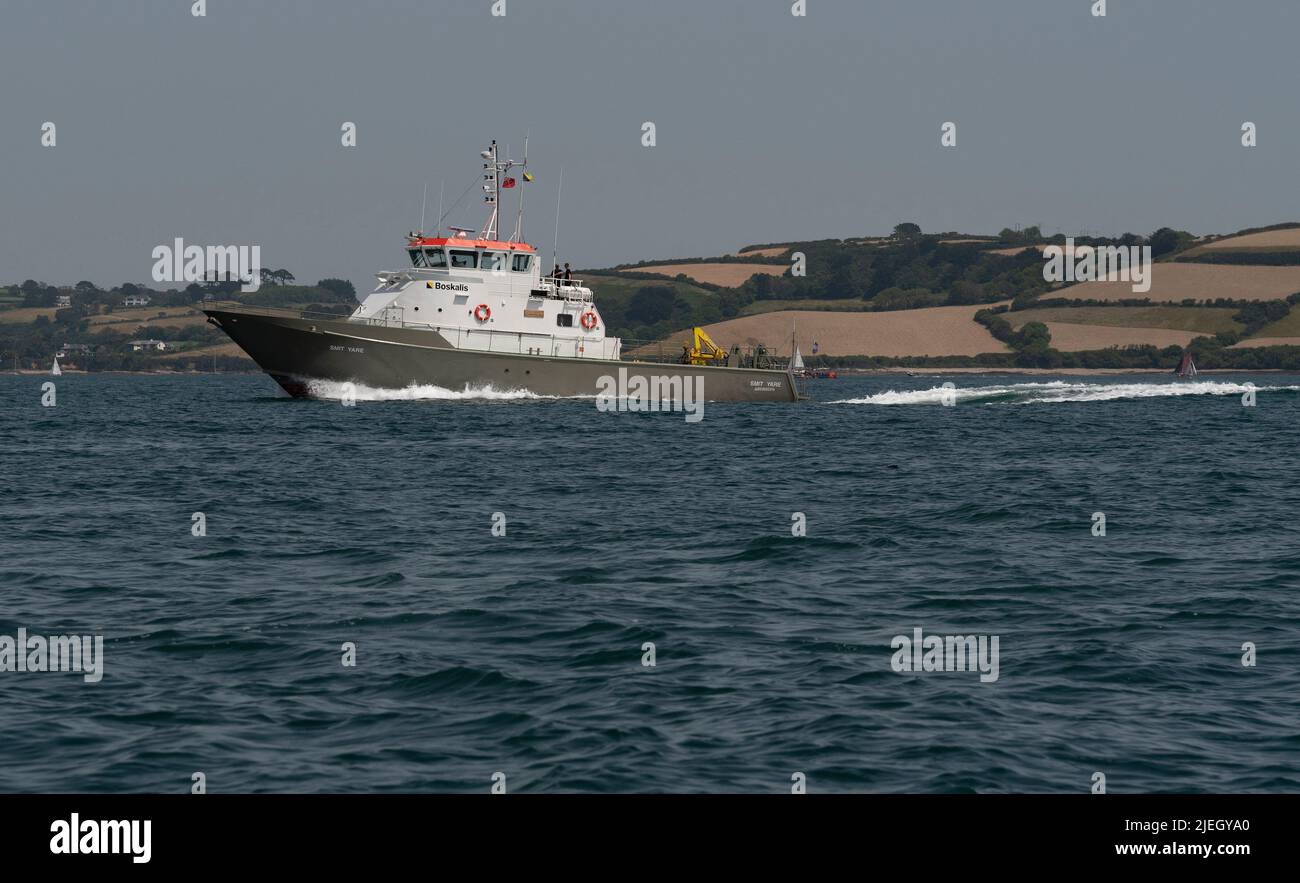 Falmouth, Cornwall, England, UK. 2022. The Boskalis Smit Yare a multi purpose workboat and training vessel crossing the Carrick Roads bound for Falmou Stock Photo