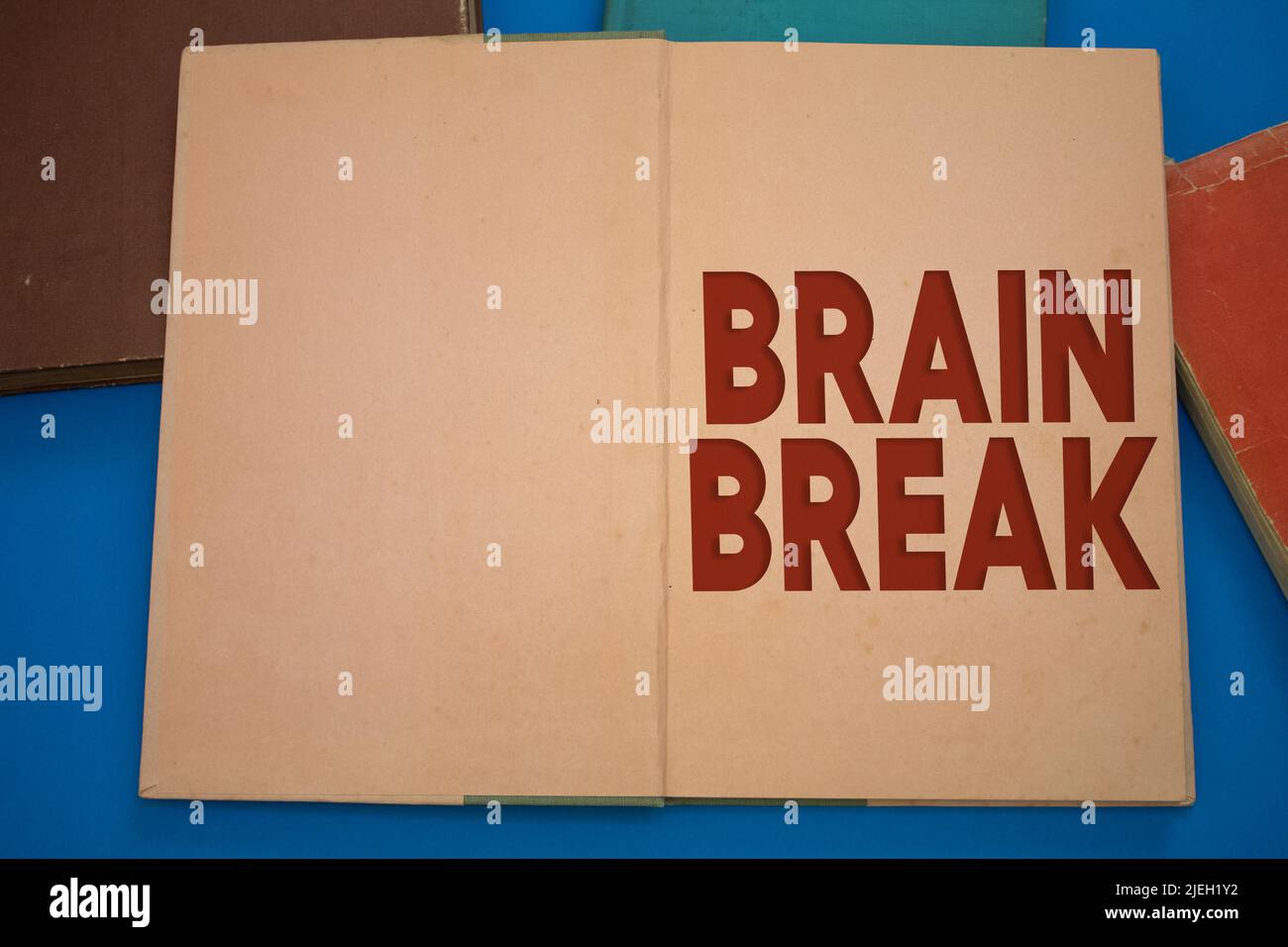 Brain Break word in opened book with vintage, natural patterns old antique paper design. Stock Photo