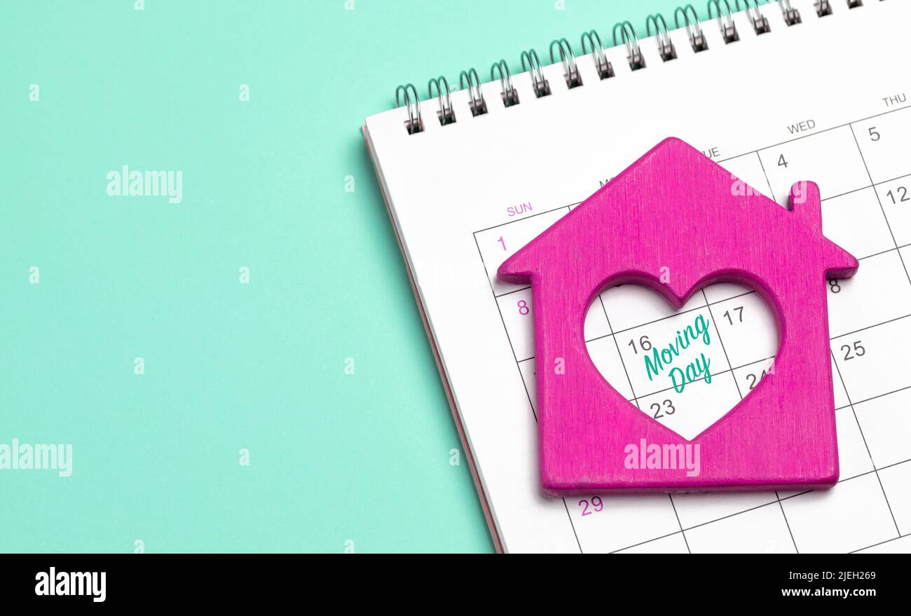 Moving day. House with a heart on the calendar. Template Copy space for text. mock-up. Stock Photo