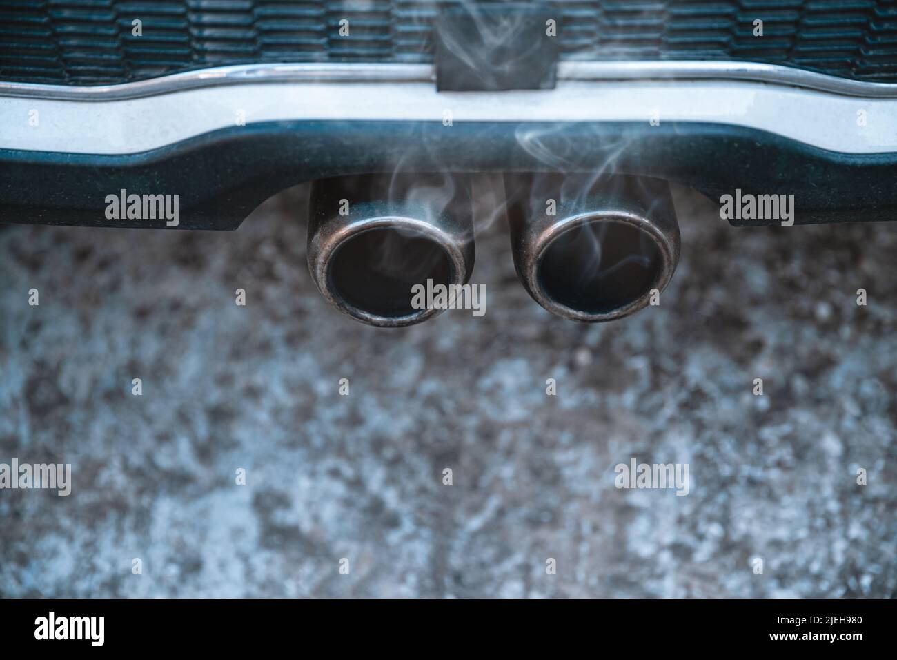 Closeup Photo of an Exhaust Pipe. Cars Emission and Pollution of an