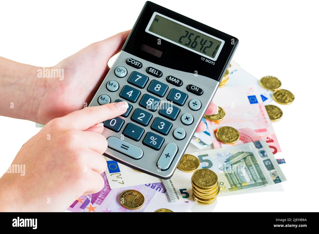 Hand mit Taschenrechner und Geldscheinen. Symbolfoto für Umsatz, Gewinn, Steuern und Kalkulation Stock Photo