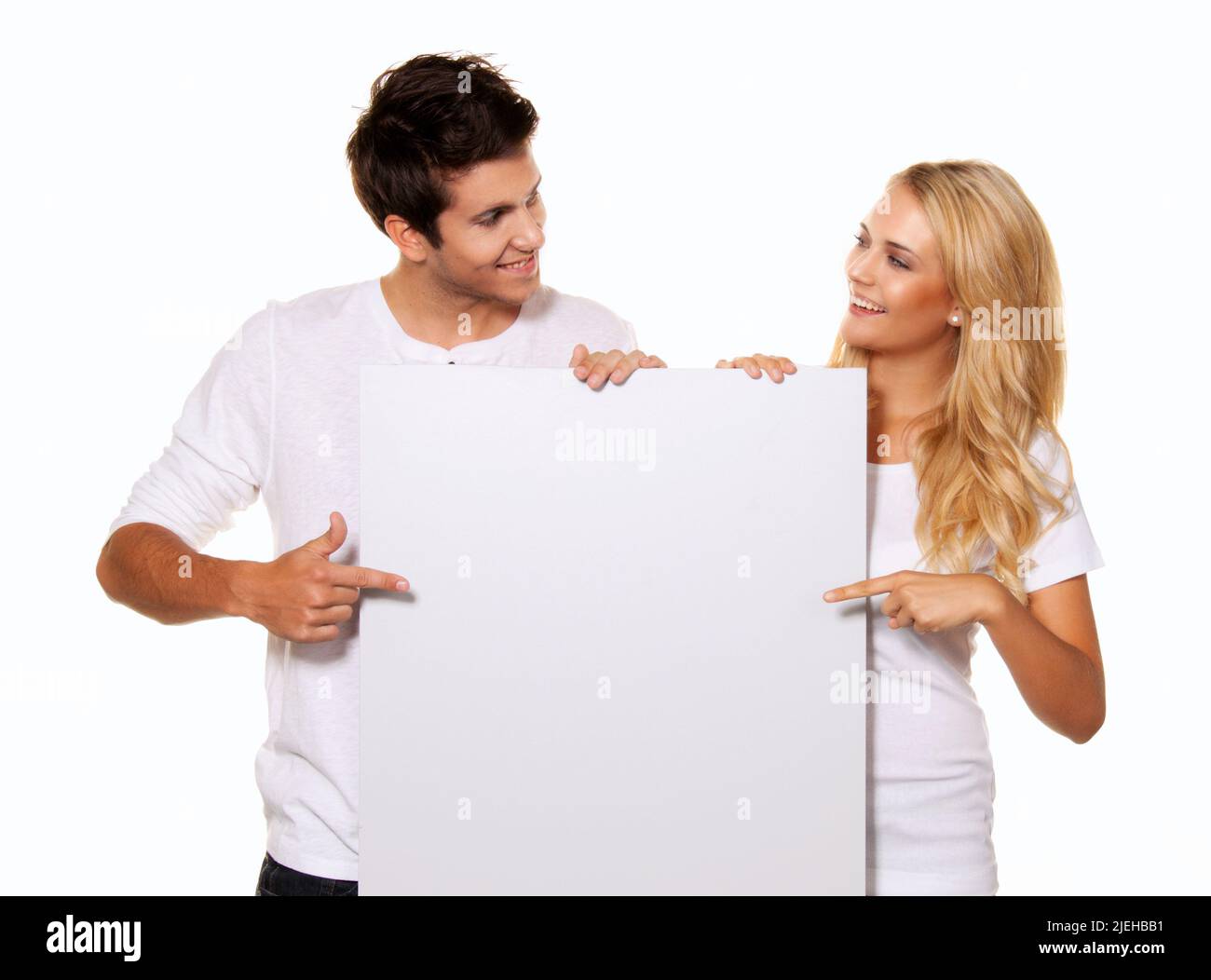 Paar mit leerem Poster für Werbung, Textfreiraum, Stock Photo