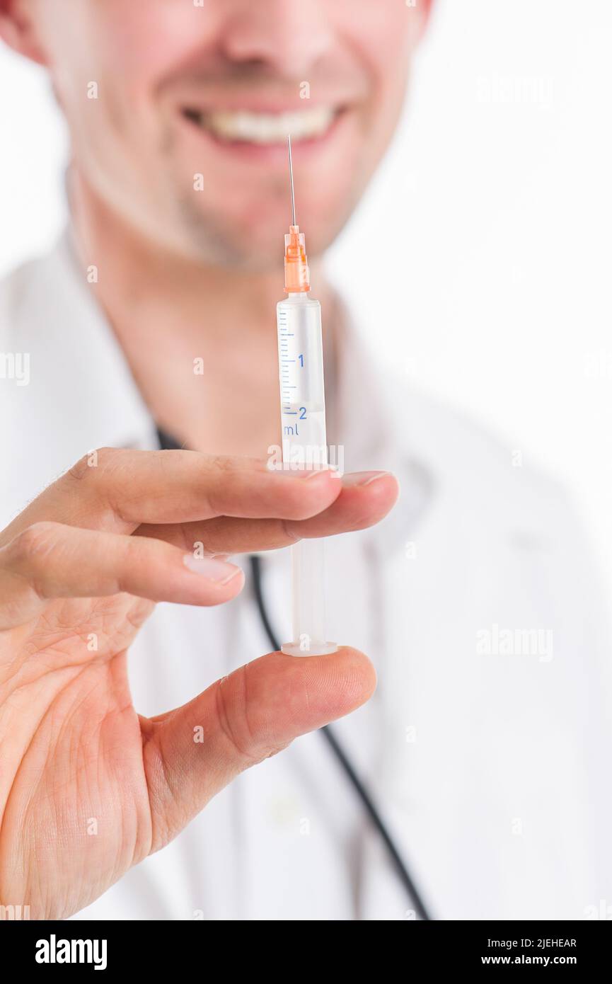 Arzt mit Spritze in der Hand Stock Photo