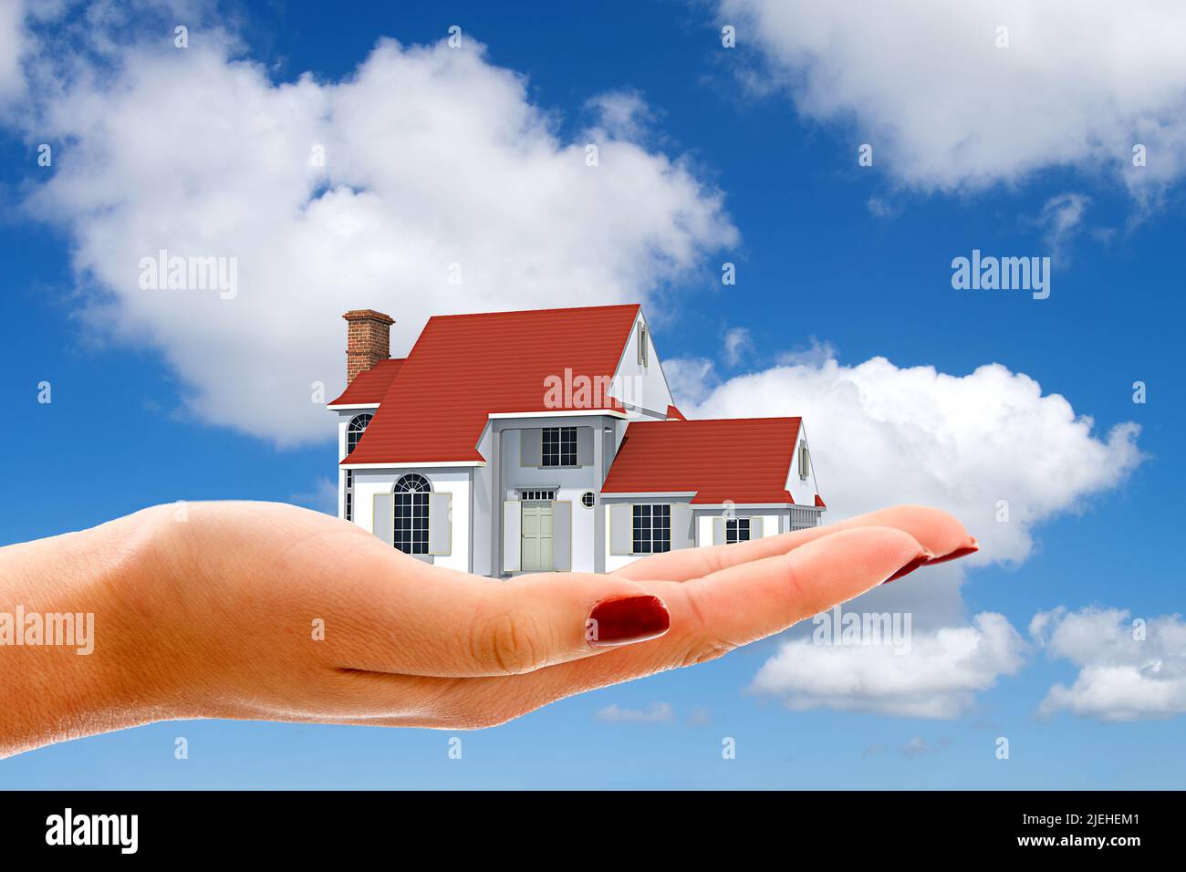 Hand mit Einfamilienhaus, Cumulus Wolken, blauer Himmel, Fruehling in Norddeutschland, Wunschhaus, Traumhaus, Baufinanzierung, Hypothek, Kredit, Stock Photo