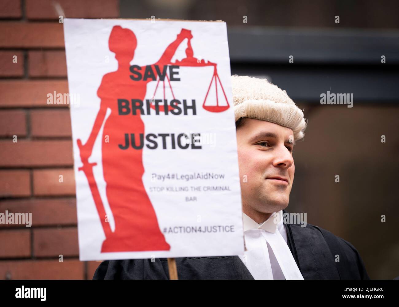 A criminal barrister from the Criminal Bar Association (CBA), which represents barristers in England and Wales, outside Leeds Combined Court on the first of several days of court walkouts by CBA members in a row over legal aid funding. Picture date: Monday June 27, 2022. Stock Photo