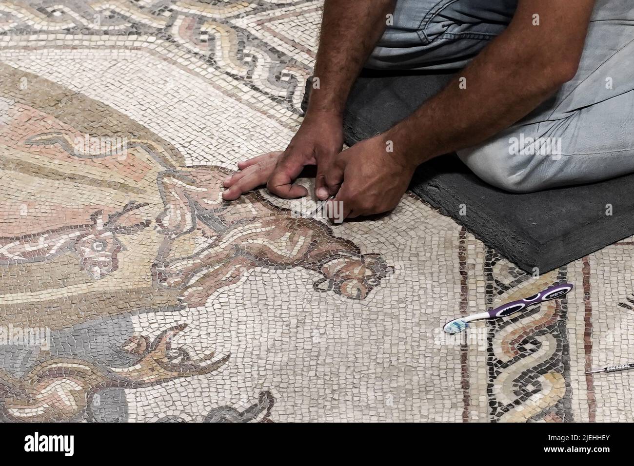 Lod, Israel. 27th June, 2022. Workers conduct last minute cleanup before the Israel Antiquities Authority inaugurates the Shelby White and Leon Levy Lod Mosaic Archaeological Center. The center's goal is to display a 1,710 square foot, Roman period (3rd to 4th century CE) mosaic which served as the floor of a living room villa in a wealthy housing complex in Lod. Credit: Nir Alon/Alamy Live News Stock Photo