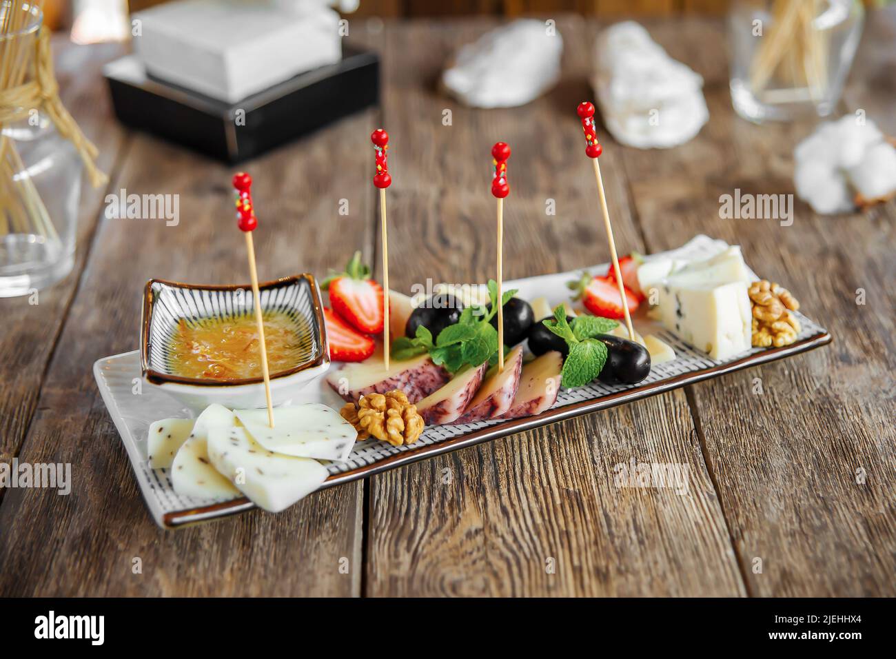 Wine cheese appetizer platter with olives Stock Photo Alamy