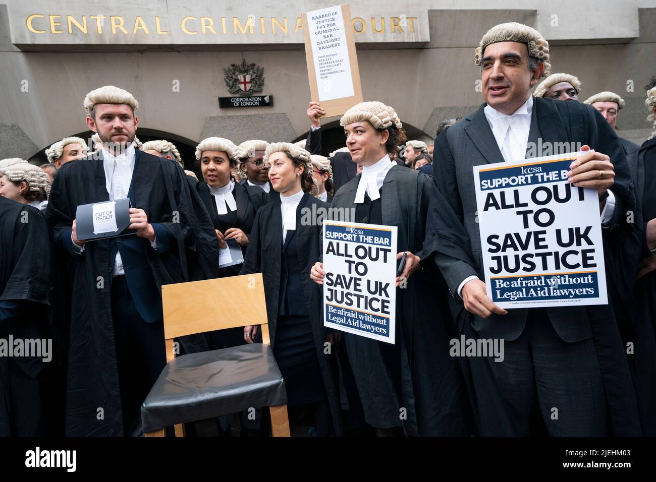 Criminal barristers from the Criminal Bar Association (CBA), which represents barristers in England and Wales, outside the Old Bailey, central London, on the first of several days of court walkouts by CBA members in a row over legal aid funding. Picture date: Monday June 27, 2022. Stock Photo