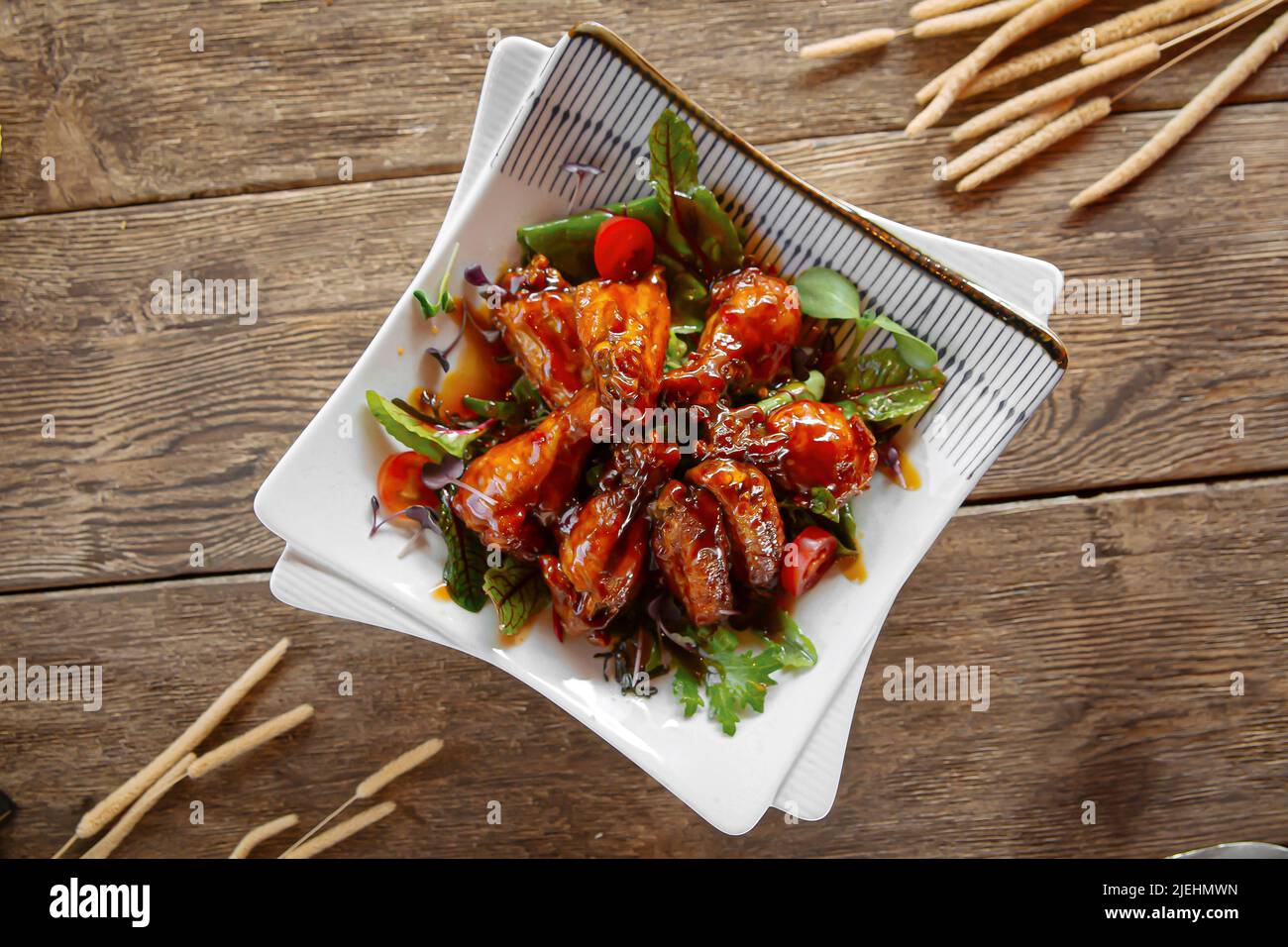 Top view on portion of glazed chicken wings Stock Photo