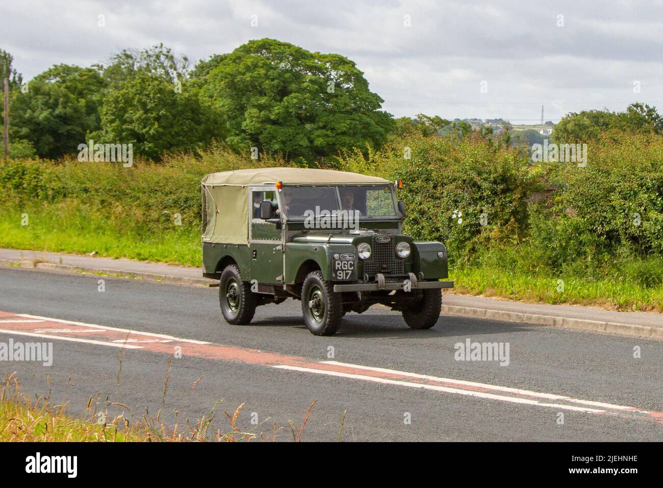 1956, 50s fifties green British Land Rover Series II 1997cc; en-route to Hoghton Tower for the Supercar Summer Showtime car meet which is organised by Great British Motor Shows in Preston, UK Stock Photo
