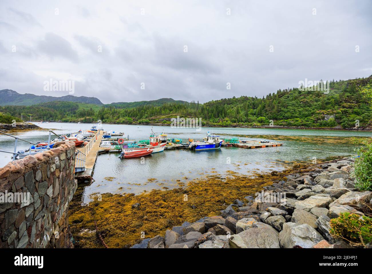 Boats moored in the harbour at Plockton, Lochalsh, Wester Ross area, a village in the Scottish Highlands on Loch Carron, setting for Hamish Macbeth Stock Photo