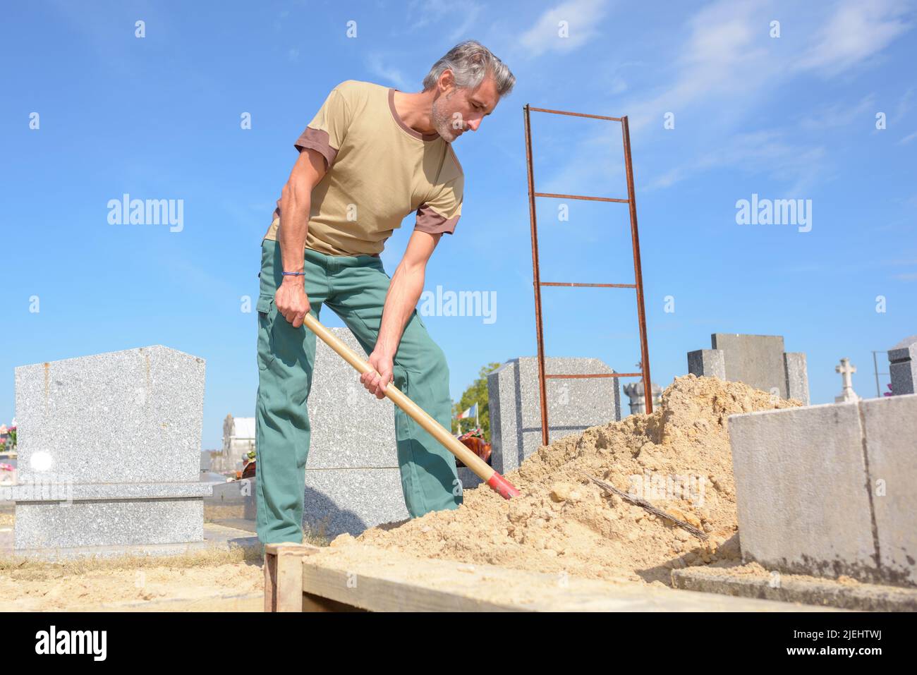 portrait of man digging a grave Stock Photo Alamy